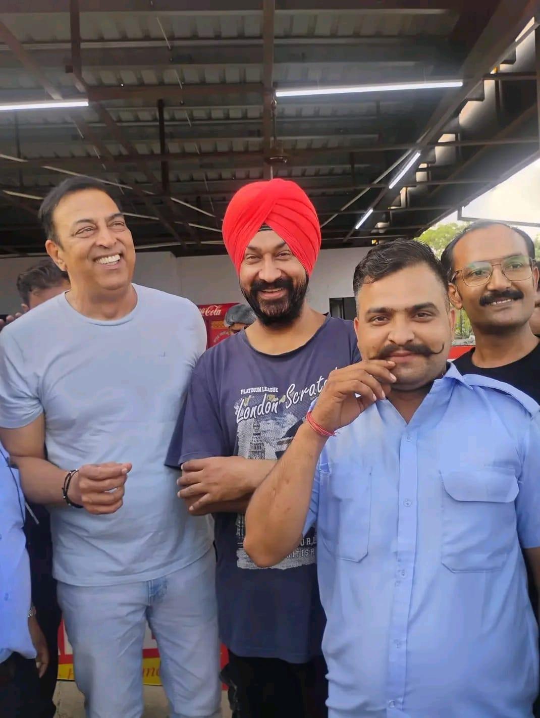 A group of travellers and their True Path driver on a dhaba break during a road trip
